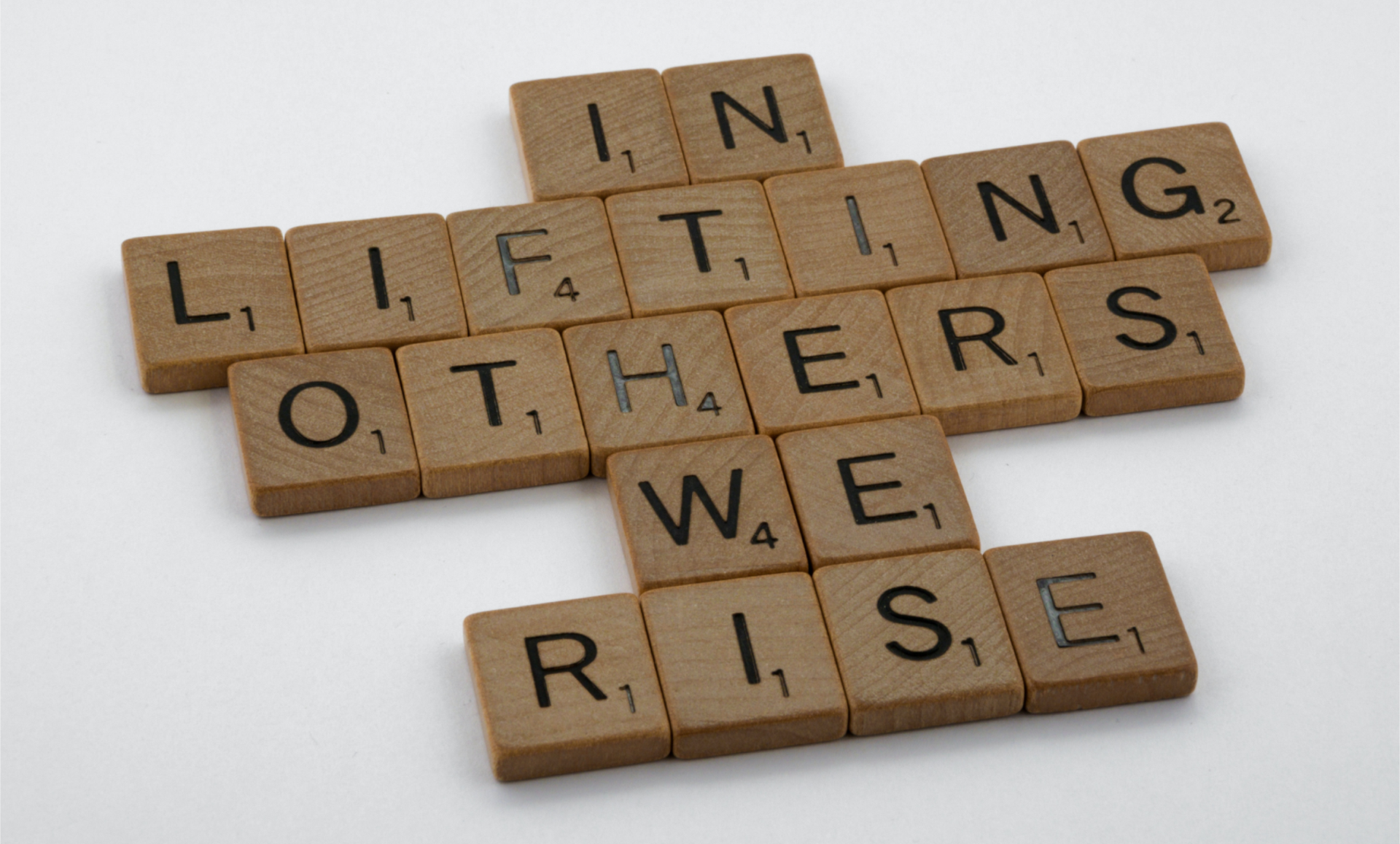 Scrabble Tiles: In Lifting Others We Rise