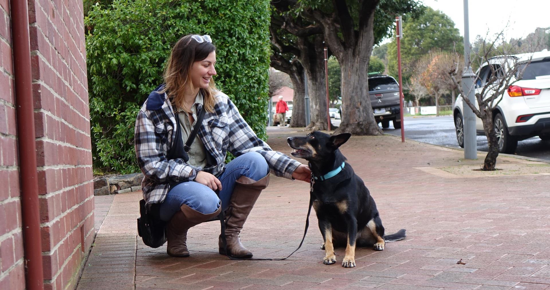 A responsible dog owner and her dog